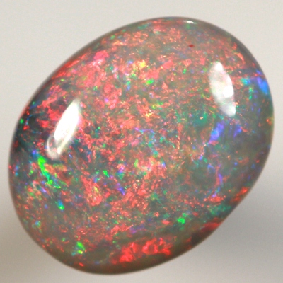 SOLID BLACK OPAL Top quality. Filled with bright red fire, high dome.  SEE VIDEO